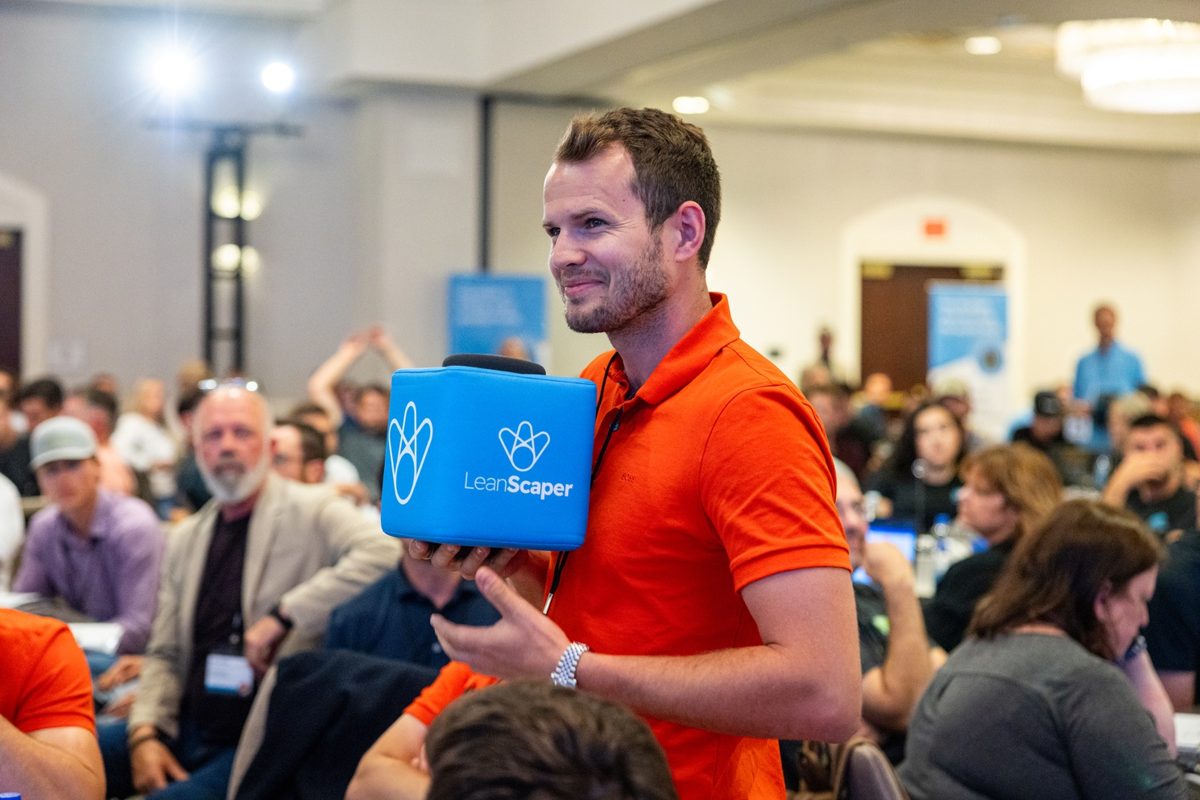 An attendee holds the LeanScaper talk box during an Intensive session